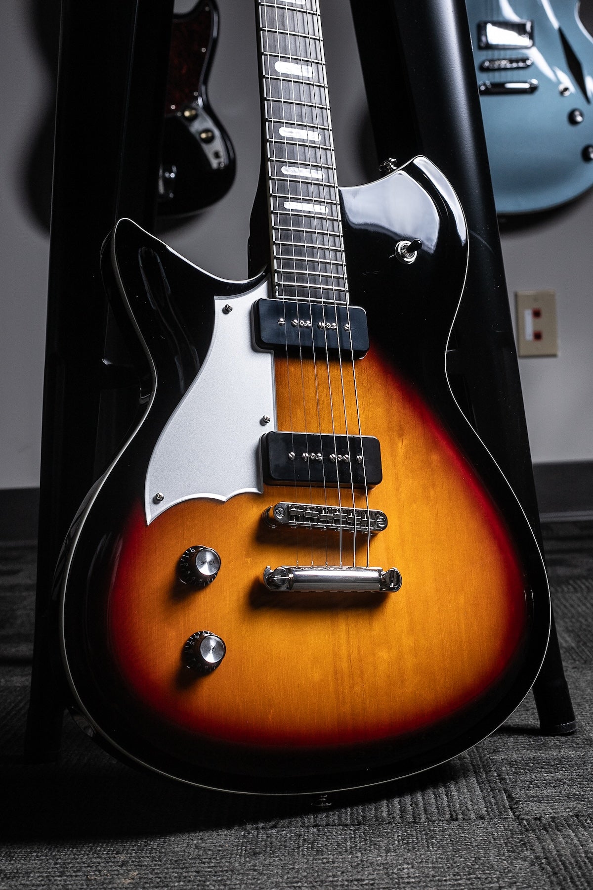 A close-up of a left handed sunburst combinata guitar from Rivolta