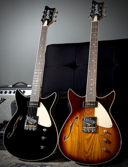 Two Rivolta Duocata electric guitars, one in glossy black and one in a sunburst finish.