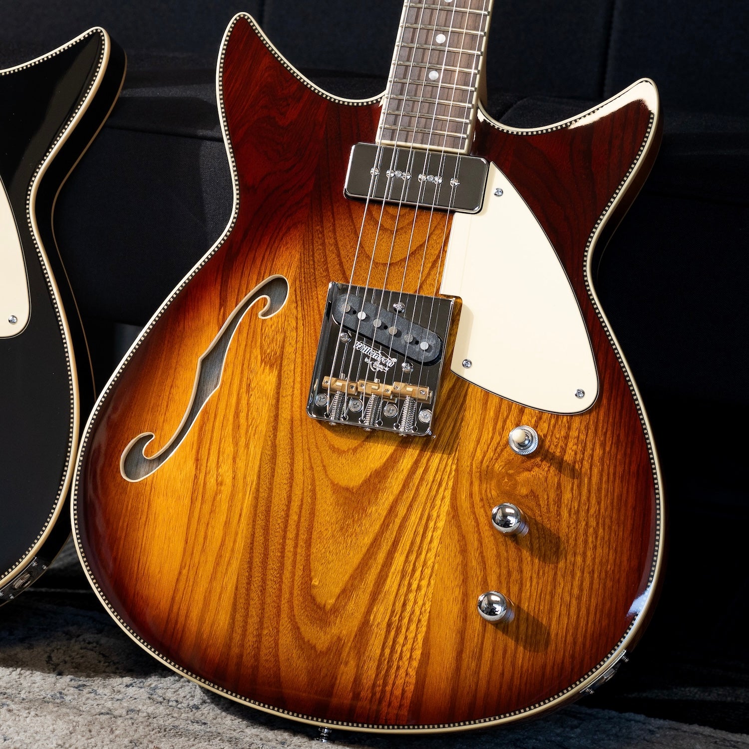 Close-up of a Rivolta Duocata electric guitar with a dark background